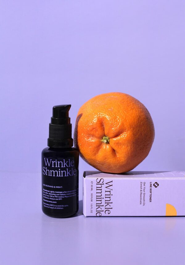 Wrinkle Shminkle by Beaut Serums standing next to an orange